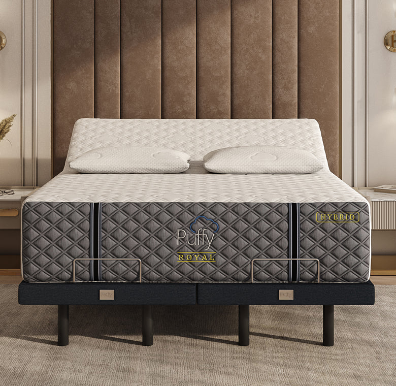 A mattress with a white top and gray sides, featuring the brand name 'Puffy Royal'